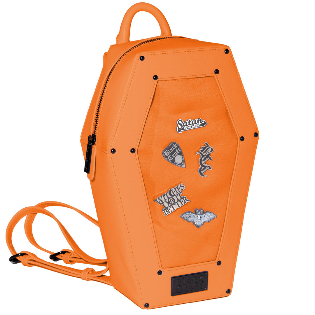 Orange faux leather coffin shaped backpack with a Pin Collecting Window. 