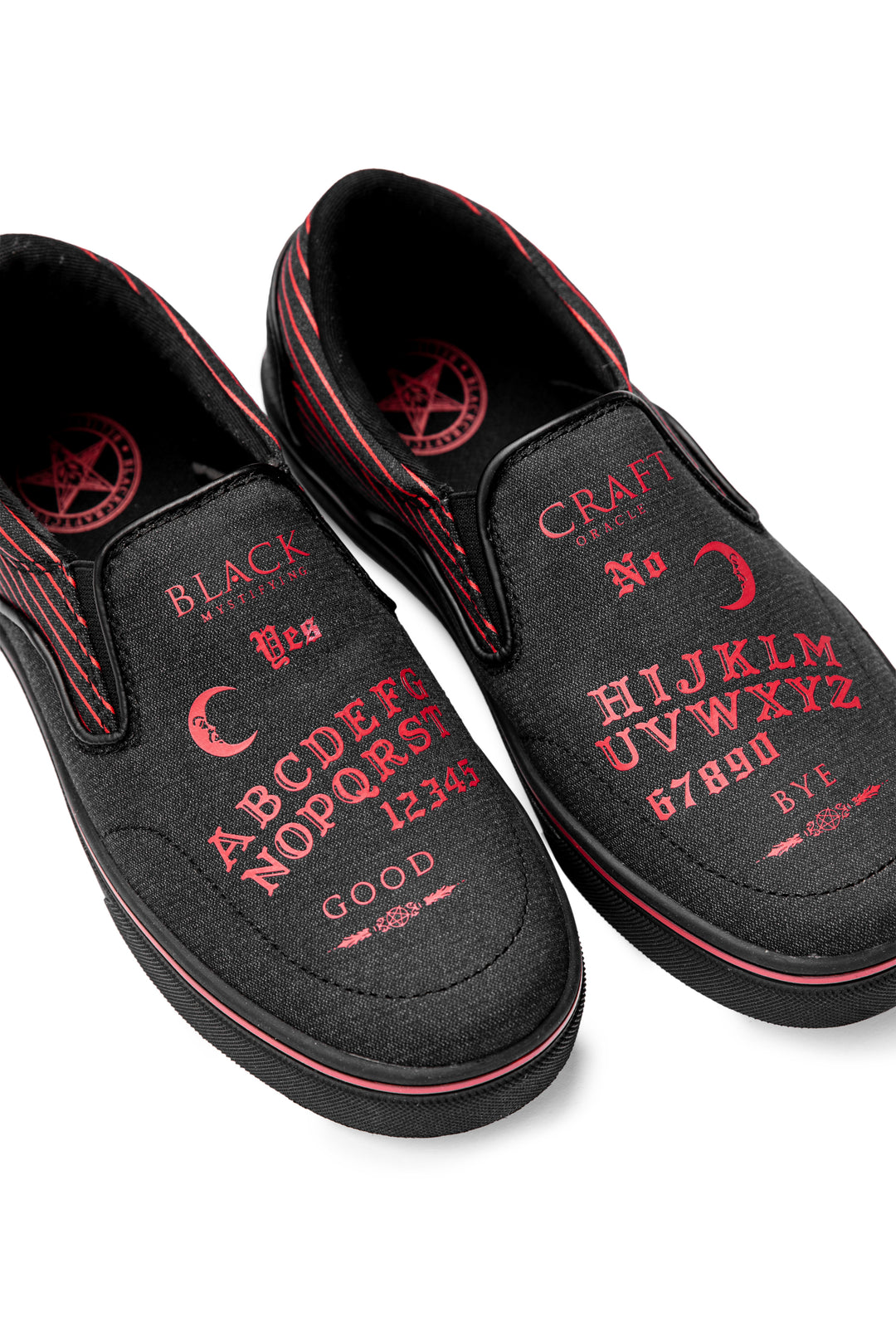 A slip on sneaker featuring our signature Ouija artwork on black canvas fabric upper and custom Blackcraft logo rubber sole.