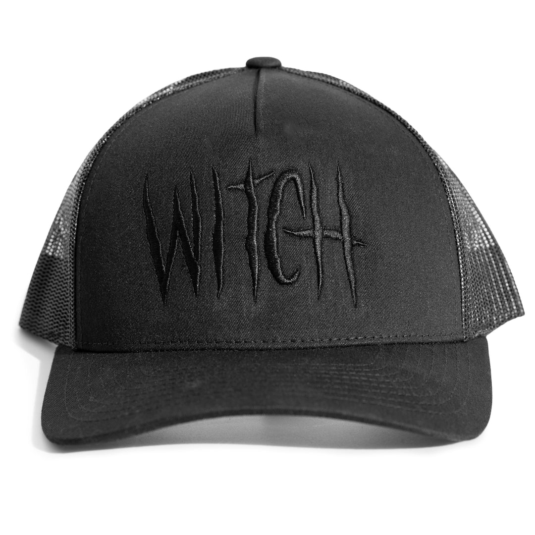 A classic black trucker hat with embroidered metal witch on the front.