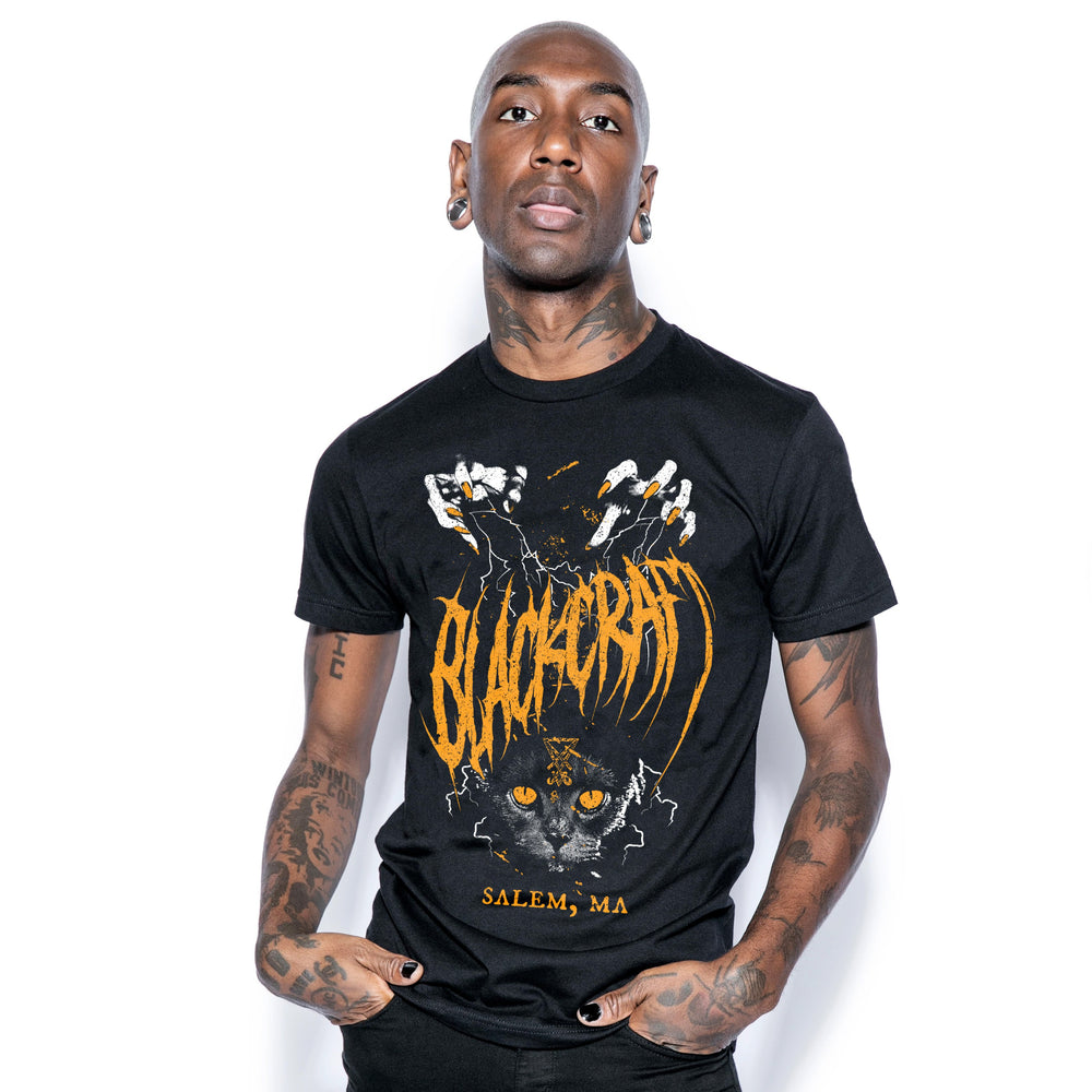 A model wearing a classic black cotton tee shirt with custom Blackcraft artwork on the front. 