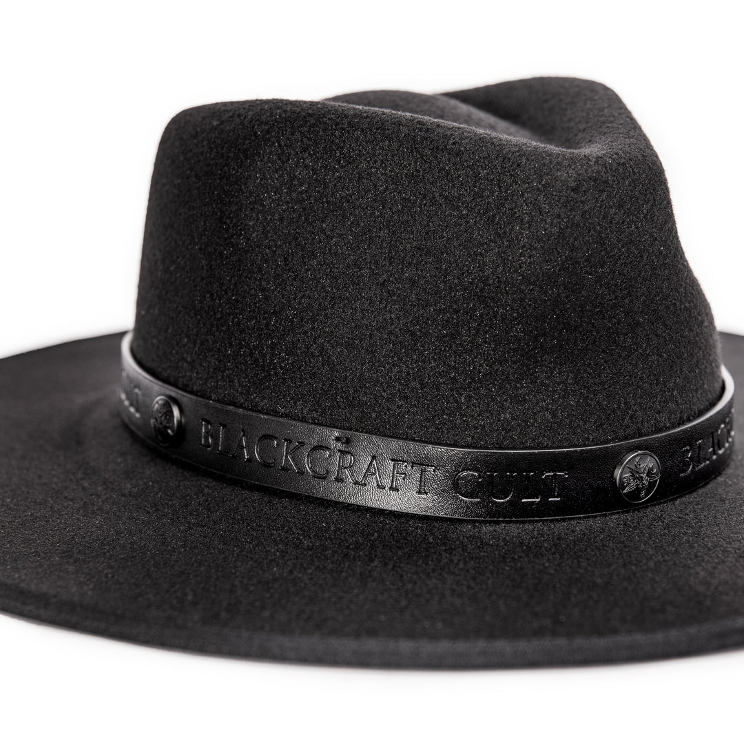 A black wide brimmed fedora hat.