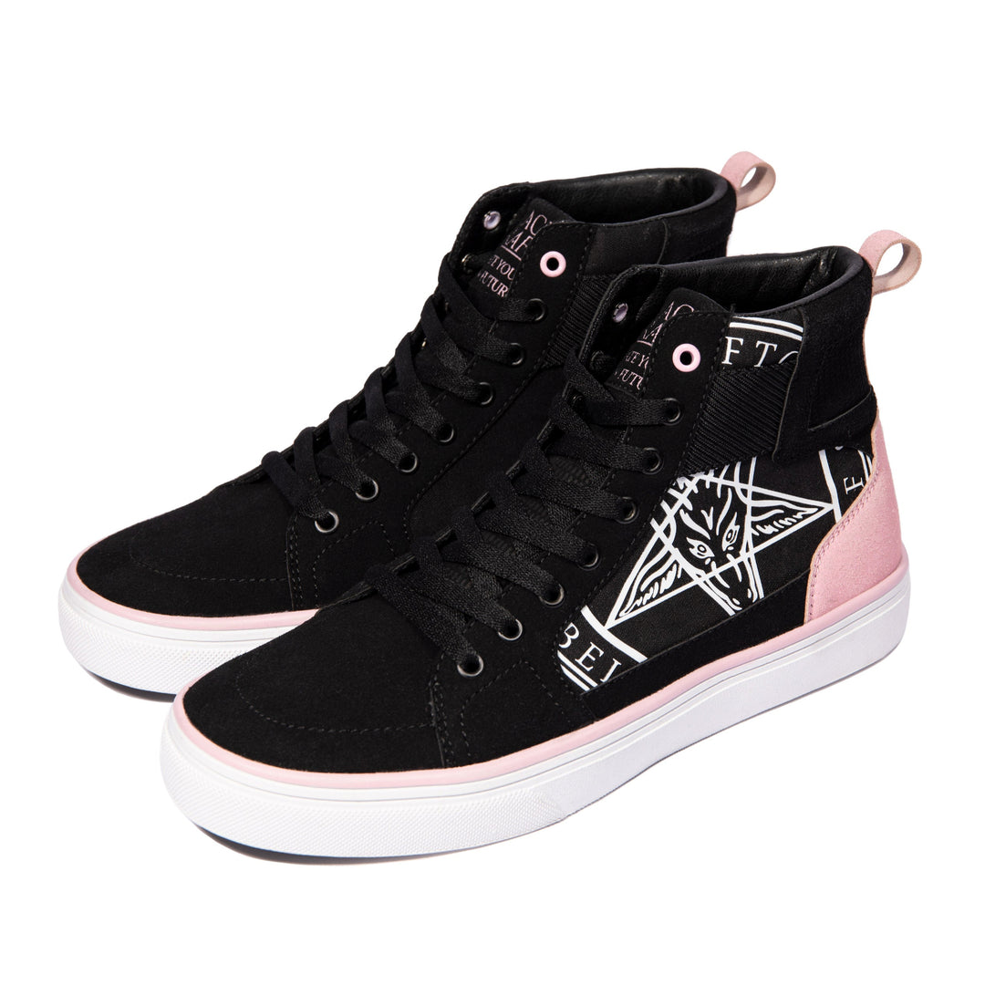 A pair of high top sneakers in pink and black. 